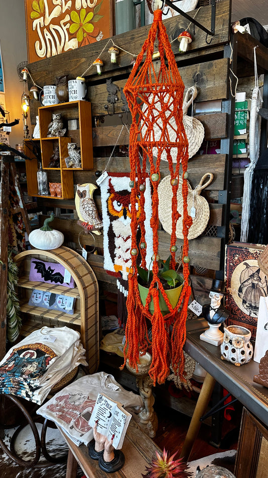 Orange macrame w/plant